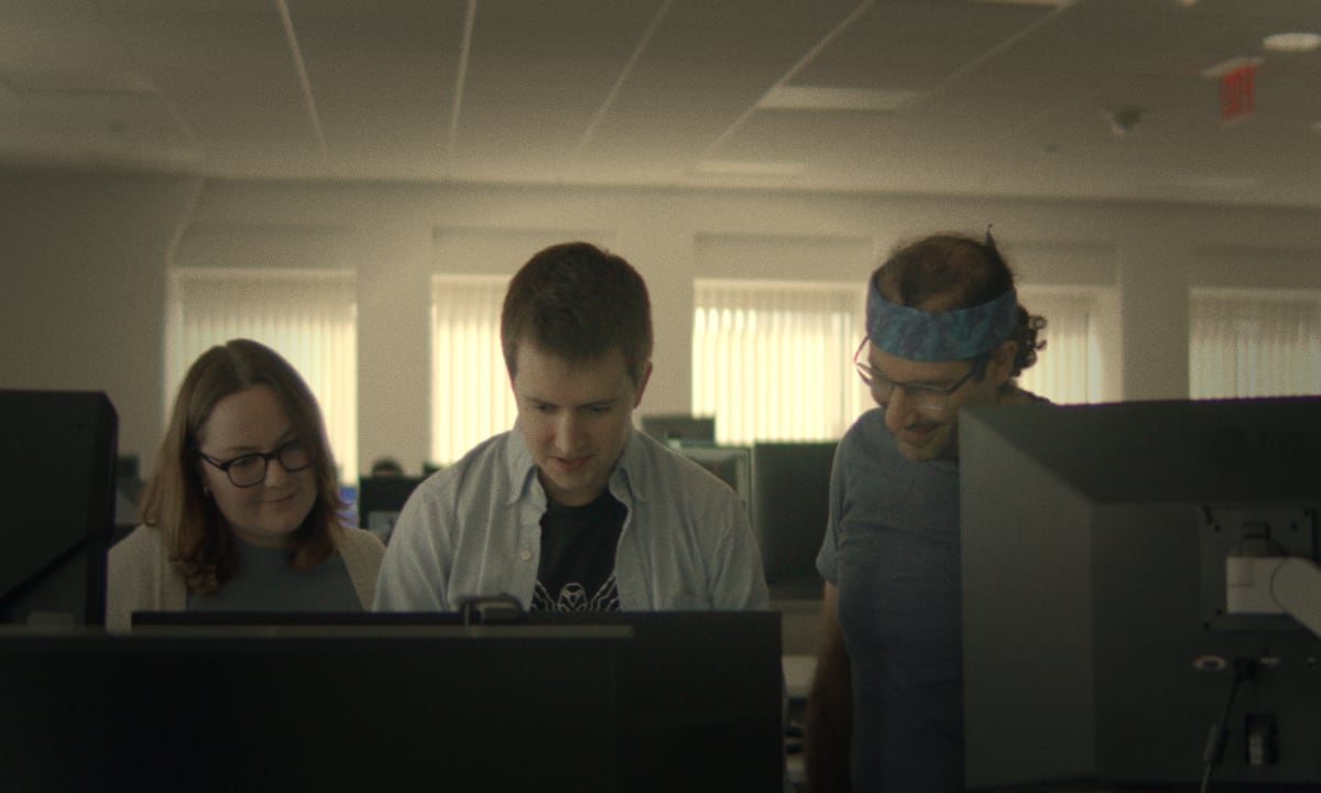 Team members collaborating in Code Metal office